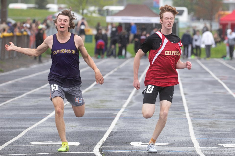 Jacob Barney of Lo-Ellen Park Secondary School crosses the finish line 0.01 seconds before Chippewa Secondary School's Liam Carruthers at the Junior Men's 100m Dash final during NOSSA Track and Field on Thursday at the Jo Forman Track.