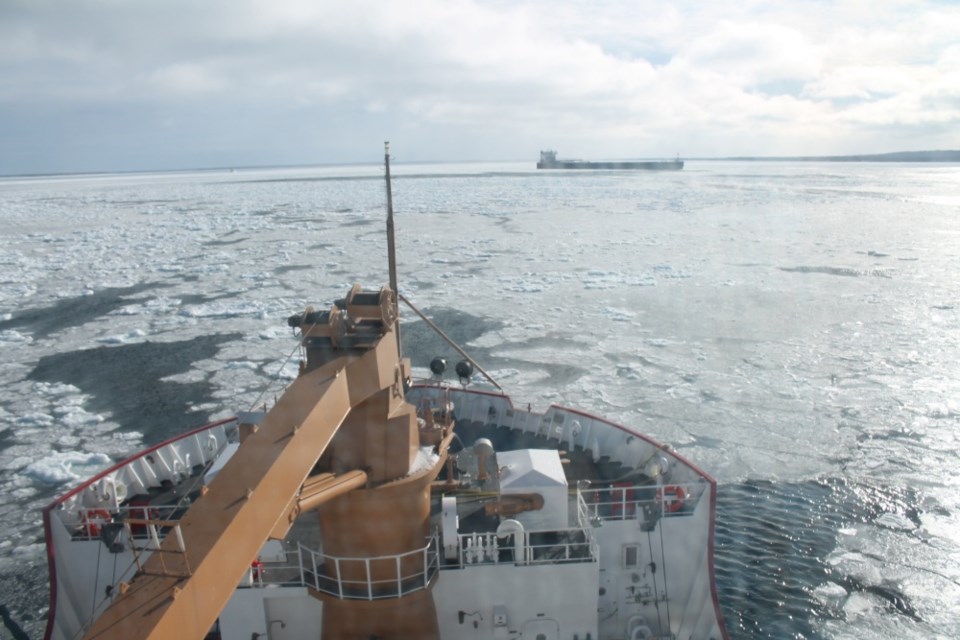 The crew of Coast Guard Cutter Mackinaw works to break free and directly assist the motor vessel Burns Harbor Jan. 12, 2018 in Whitefish Bay and the St. Marys River. Crews worked hard to ensure the safe and effective movement of commerce prior to the closure of the Soo Locks. (U.S. Coast Guard photo by Lt. j.g. Sean Murphy).