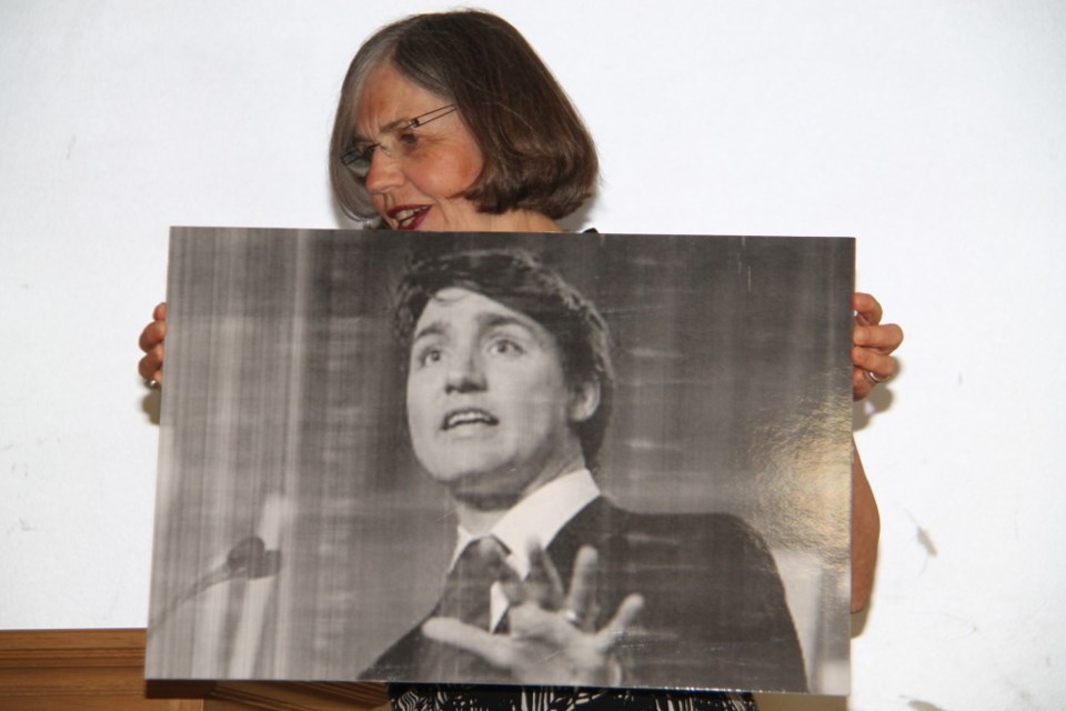 Linda Savory Gordon, Coalition for Algoma Passenger Trains (CAPT) spokesperson, with a photo of an invited but absent Prime Minister Justin Trudeau at a CAPT meeting at Sault Ste. Marie’s Civic Centre, July 28, 2017.  Darren Taylor/SooToday 

