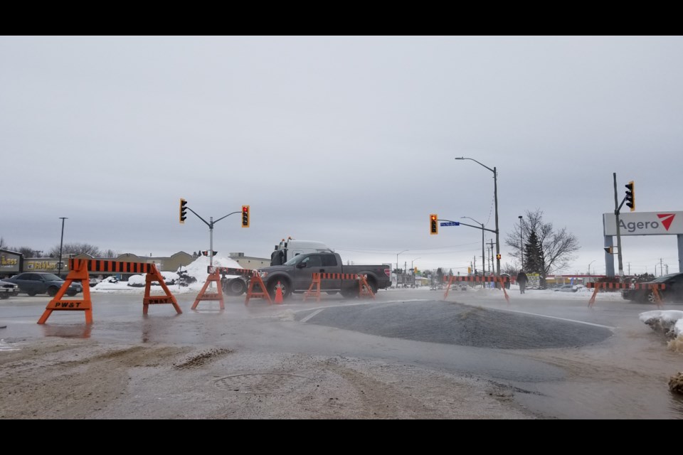 An apparent watermain break at the corner of McNabb Street and Great Northern Road left the intersection difficult to pass through. VillageMedia staff photo