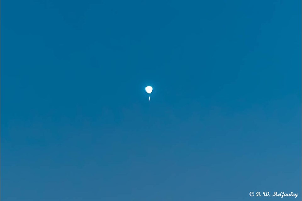 Reader wonders if this was a weather balloon floating high above Batchawana Bay this morning.