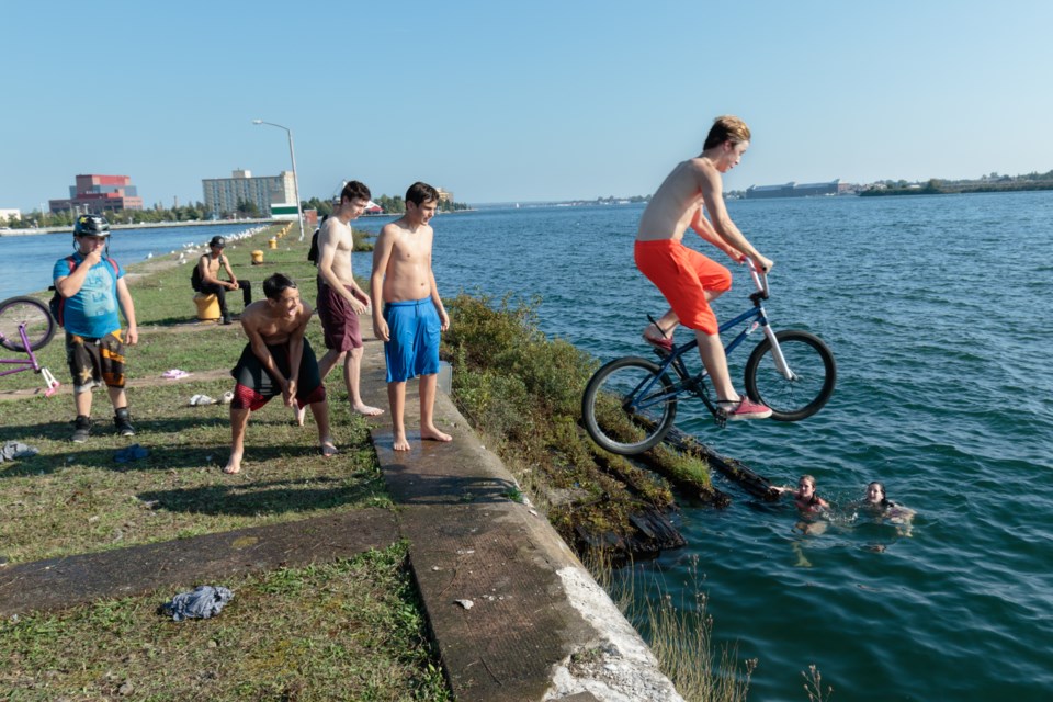 Zander Brown rides his BMX off a Whitefish Island jetty and into the St. Marys River on Sunday. Sunday was the hottest ever September 24 on record for the Sault, and the hottest day of 2017 so far. Jeff Klassen/SooToday