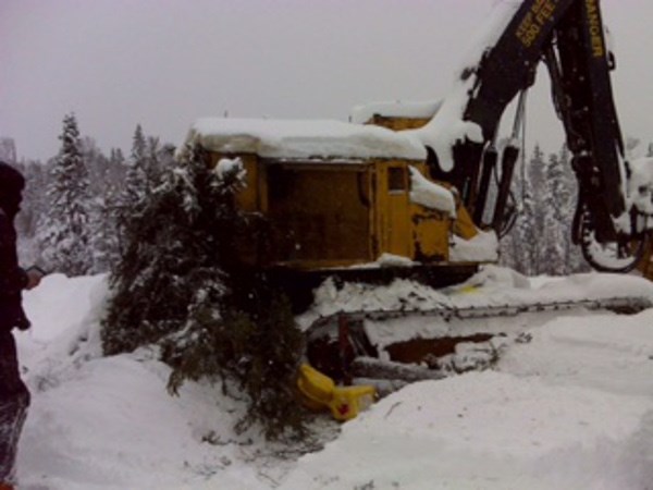 A logger took shelter under his broken down logging vehicle before being found by a Sault family and their friends Dec. 17, 2016. Photo supplied by Tanya Martin. 