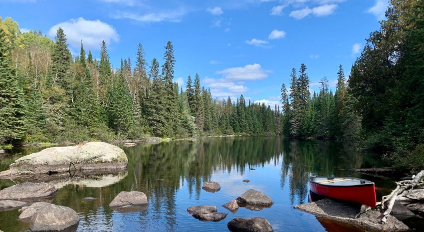 red-canoe-on-a-rocky-canal-aspect-ratio-850-465-1