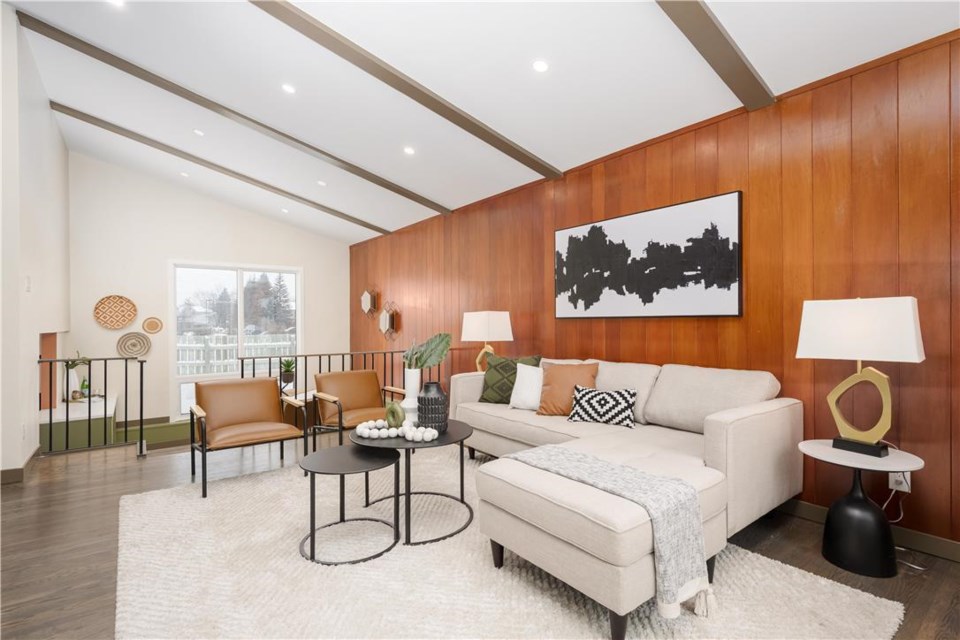 1b-living-room-with-wood-panelling-and-sloped-ceiling