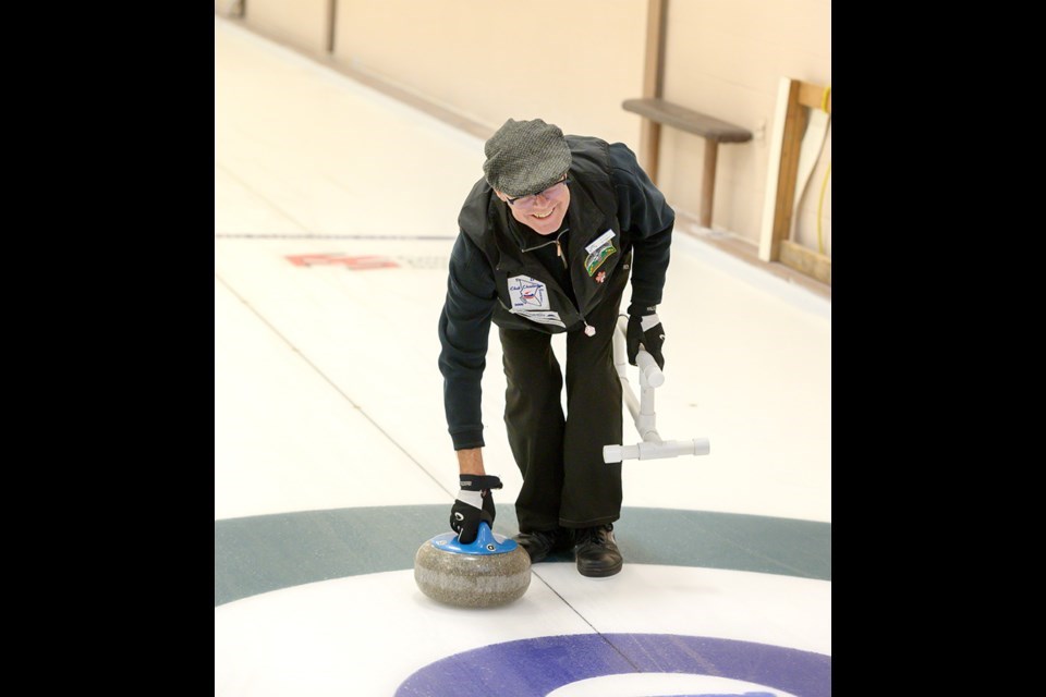  Curler Hal Hughson at an open house for curling before the pandemic. 