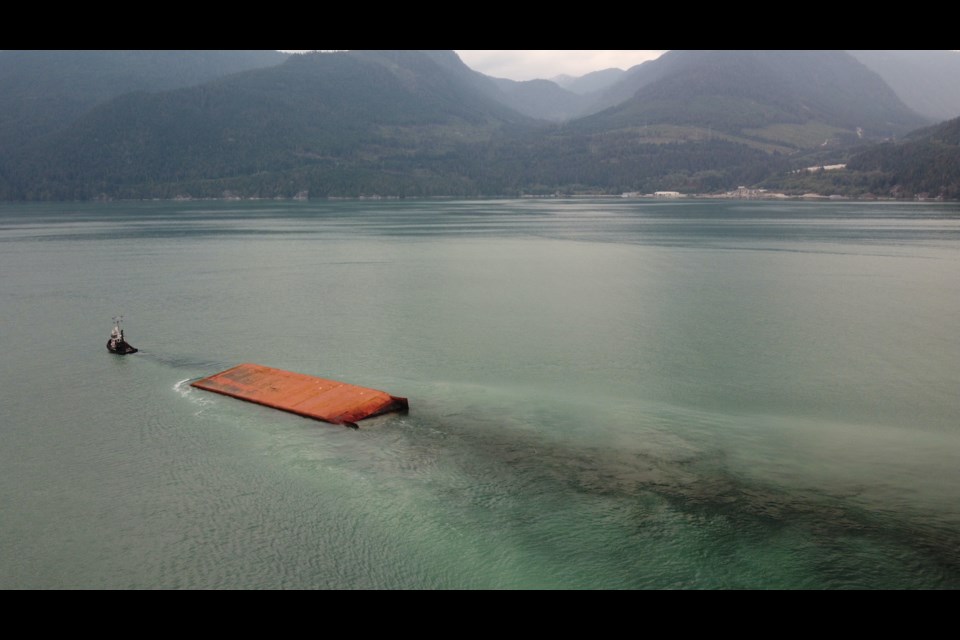 The barge beached at Watts point all winter is gone.  Squamish conservationist John Buchanan spotted it heading south in Howe Sound Wednesday (Sept. 28) morning, being towed by tug Jennell II. 

