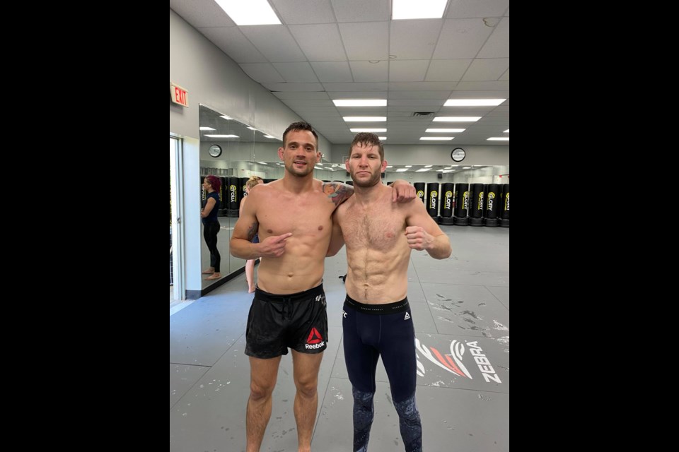 Cole Smith is pictured here with UFC fighter and coach James Krause. 

Courtesy Cole Smith