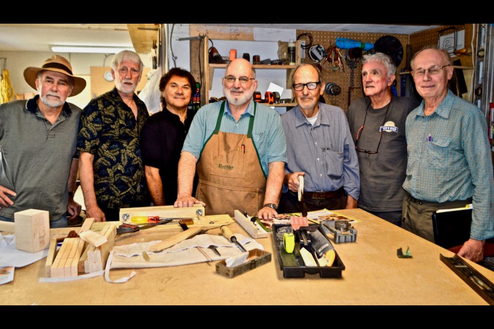 Donald Lawton (centre) with other Squamish Men's Shed participants. 