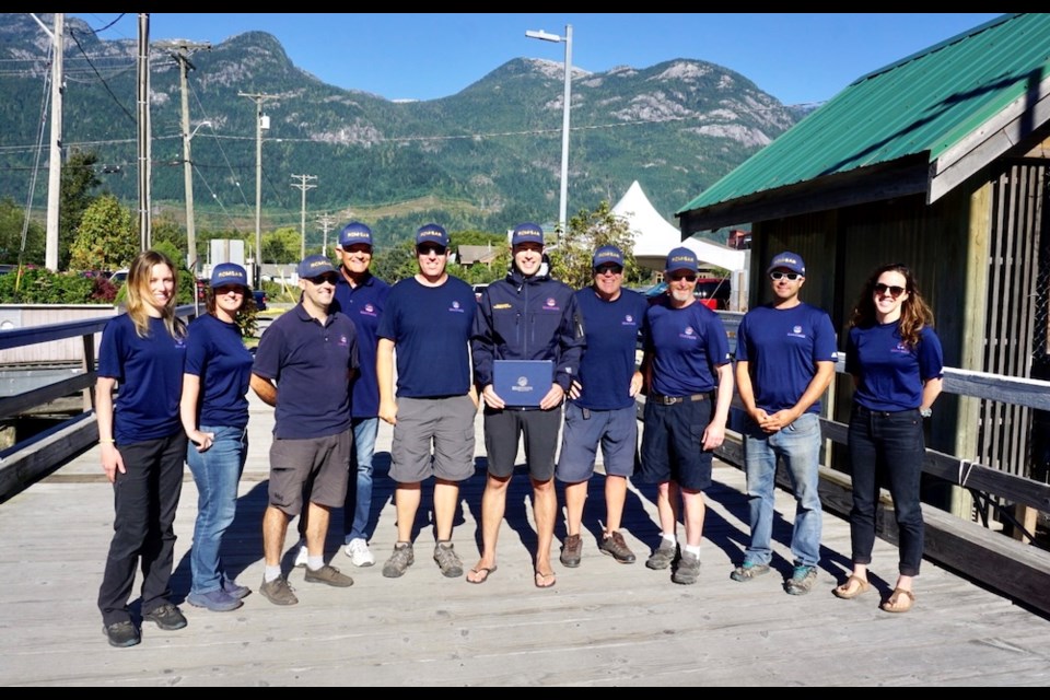Calum Davidson received the award on Sept. 7 from Bill Riggs, the CEO of the Royal Canadian Marine Search and Rescue, near the Squamish Yacht Club. Numerous Squamish RCM SAR teammates joined Davidson to celebrate the award.