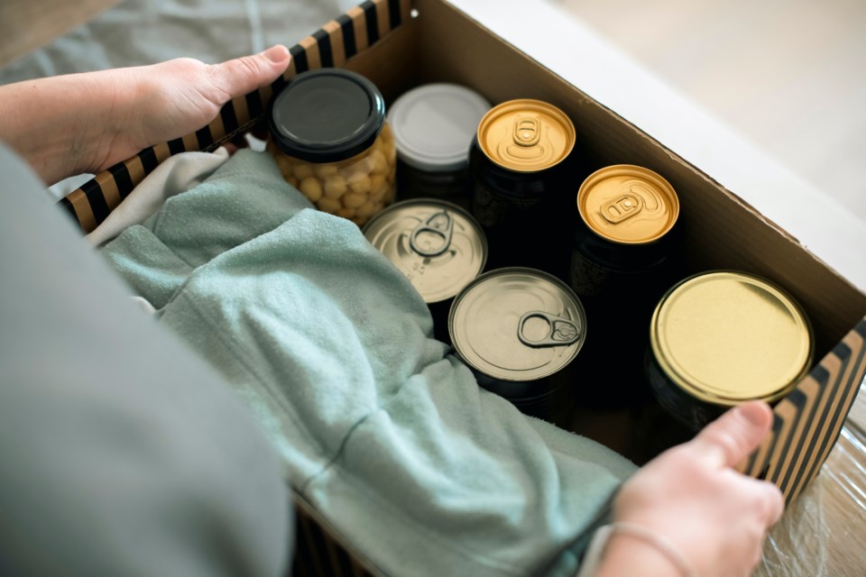 A person packing a donation box. 
Community volunteers will deliver flyers and drop boxes during the week of Sept. 19 to 22 to various neighbourhoods in Squamish. 