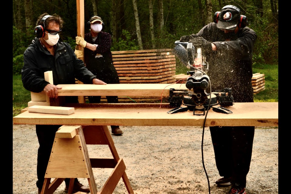 Robert Goluch (left) working on a Squamish Men's Shed project. 