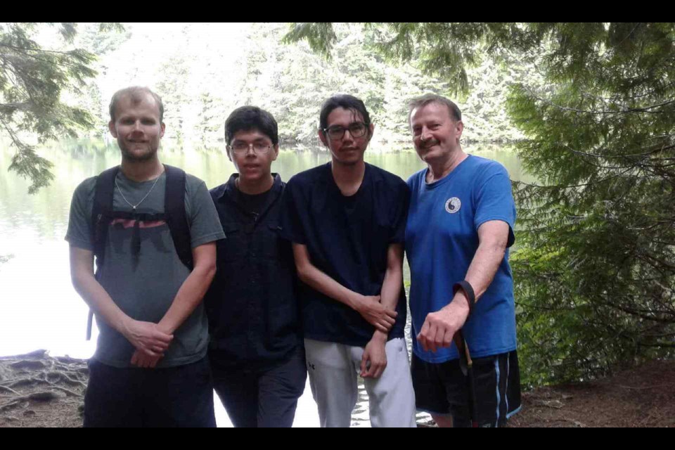 Quinten Ross and Richard Iyago with Justin and Ken Perry on a recent hike to Edith Lake. 