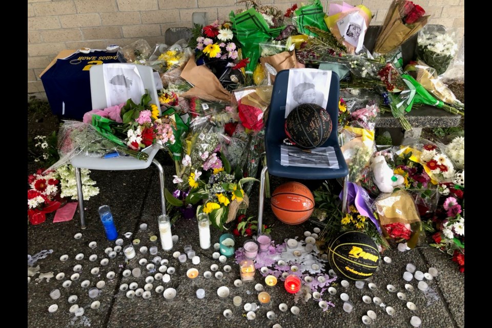 A memorial to Squamish’s 17-year-old Alex Reyes continues to grow at the entrance to Howe Sound Secondary. 