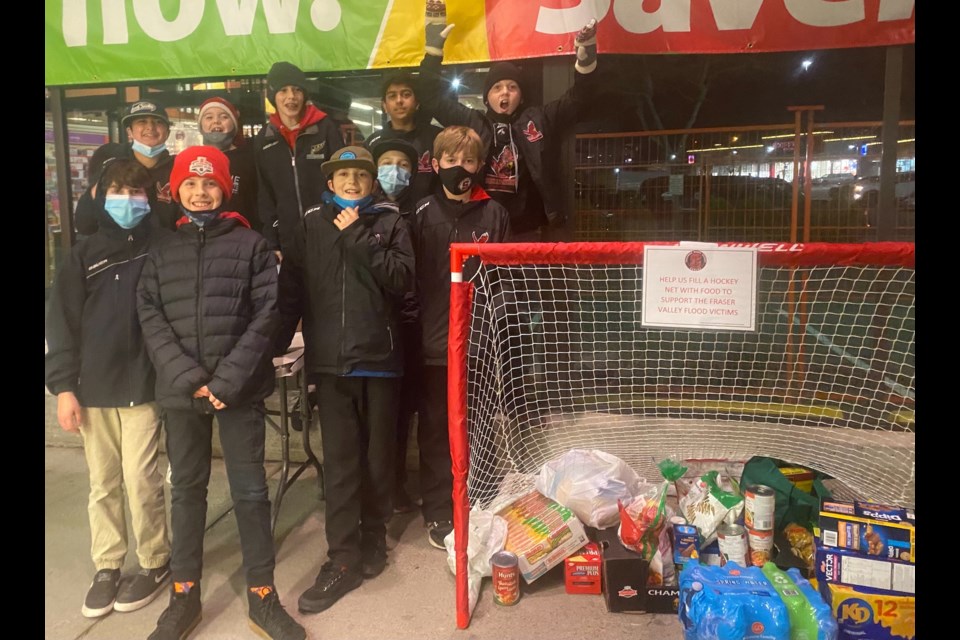 U13 A2 ƵappEagles players. outside Save-On-Foods.  