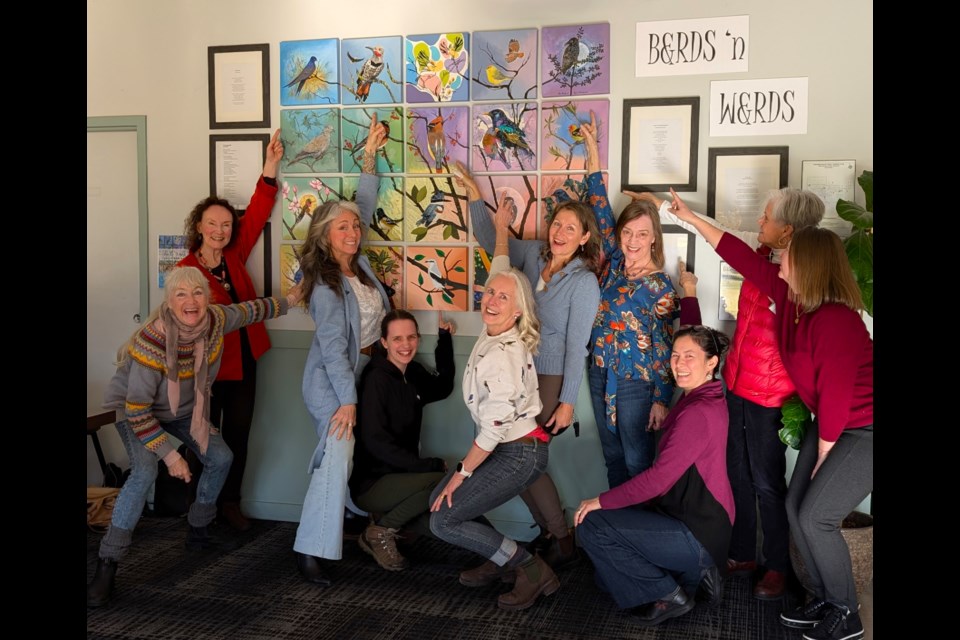 “Birds & Words" is a collaboration between local artists Toby Jaxon, Tatiana Lee, and Zoë Evamy, featuring 20 canvases that are connected to each other and show different kinds of birds, branches, and lots of bright colours.