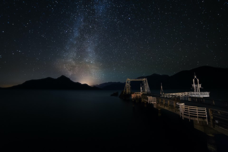 Porteau Cove Provincial Park at night with milky way above. The Sea to Sky Corridor has less light pollution than the city and so more opportunities for stargazing. 