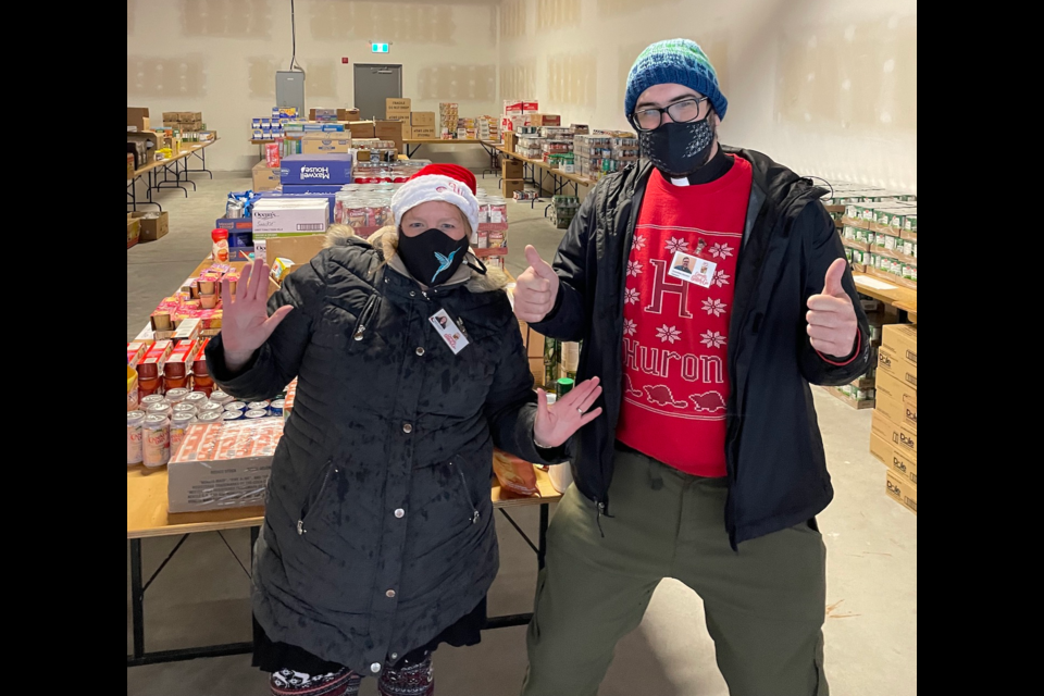 Rev. Karen Millard and Rev. Cameron Gutjahr with donations.