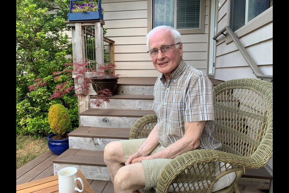 Ron Sutherland in his yard on Aug. 18.