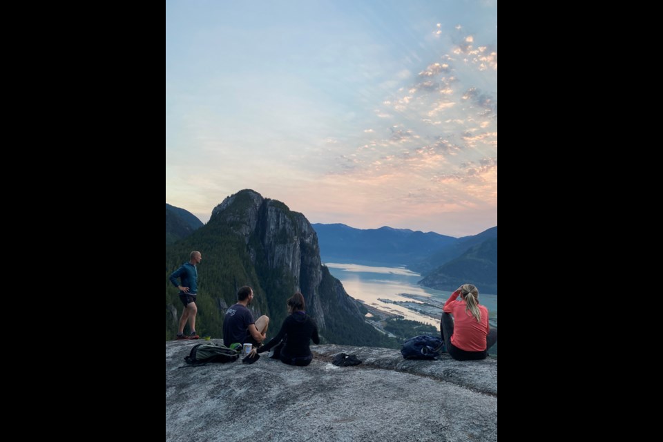 A contingent of Capra Running Co. group members look out over Howe Sound as part of a pre-pandemic outing.