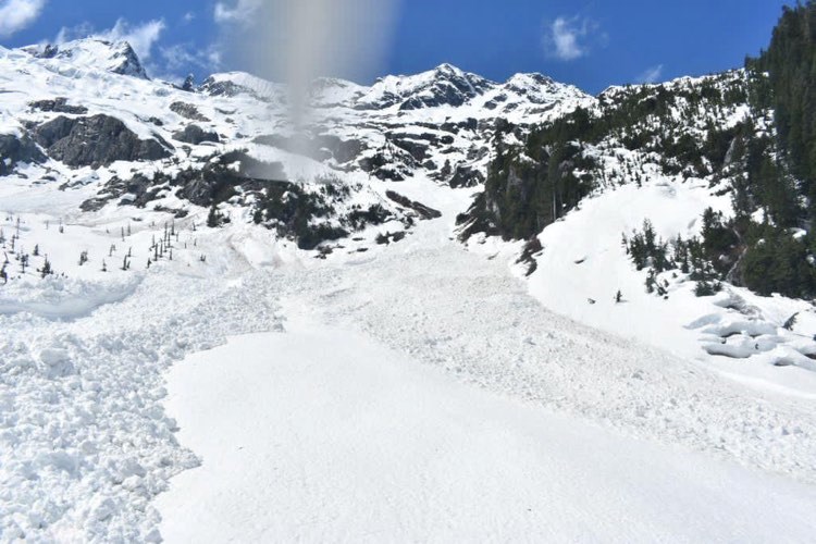 On Sunday, an avalanche swept through the Tantalus Traverse, stranding a party of three backcountry skiers.