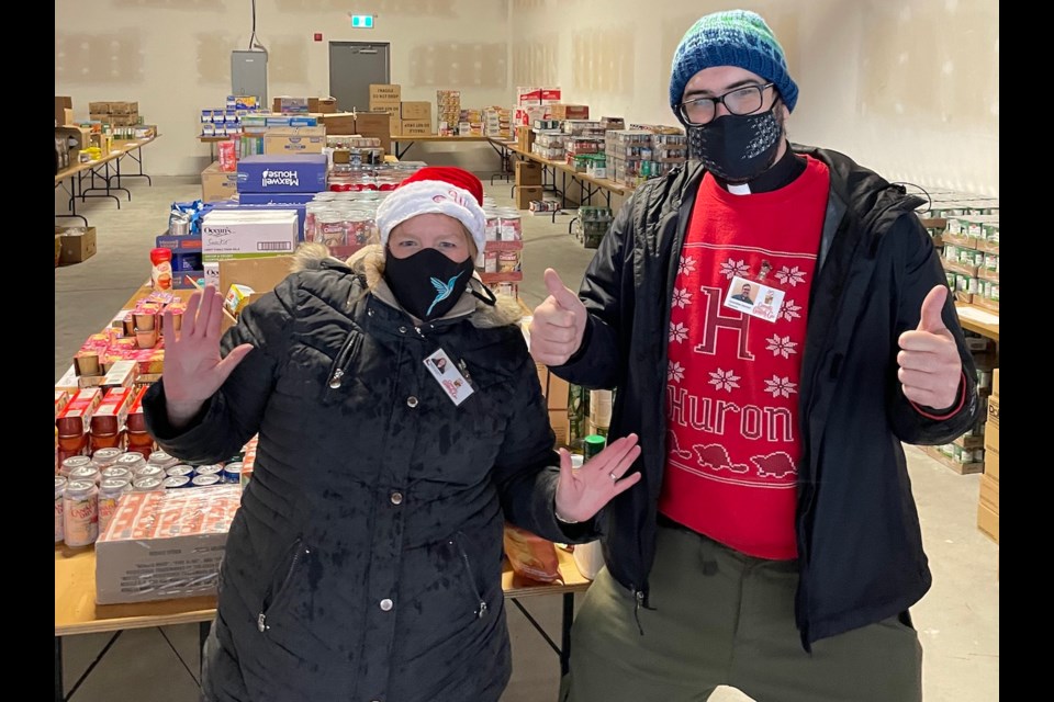 Rev. Karen Millard and Rev. Cameron Gutjah with donations