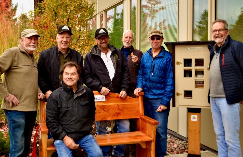 Members of the Squamish Men's Shed. Robert Goluch is sitting on the bench. 