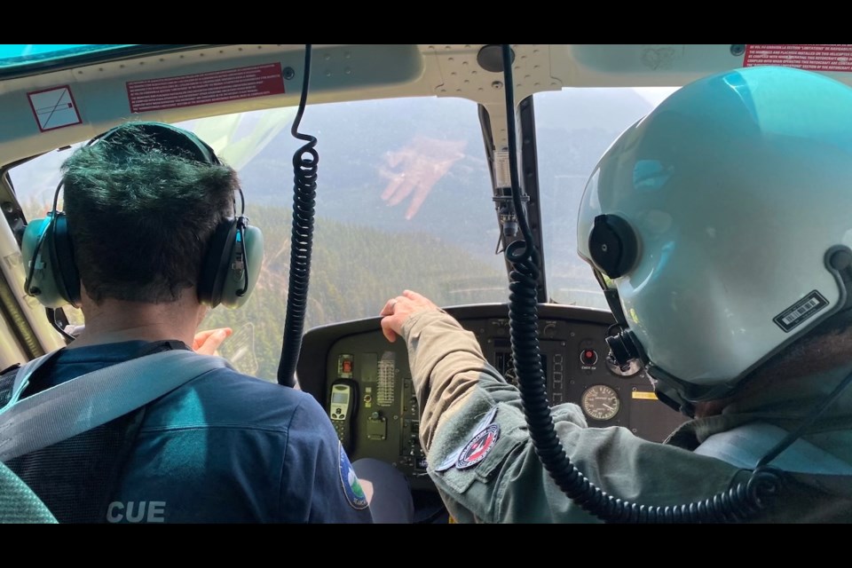 Searchers in action on the 100th rescue. 