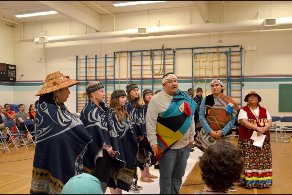 Speaker Aaron Williams, in the centre, explained the meaning of St'a7mes on June 21. 