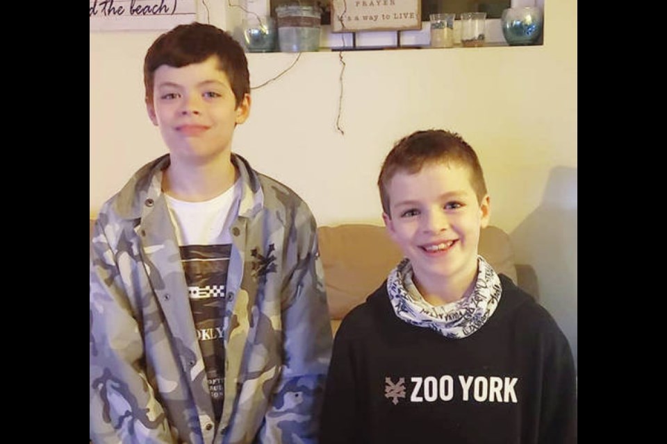 Jesse Johnson and his eight-year-old brother Wyatt.