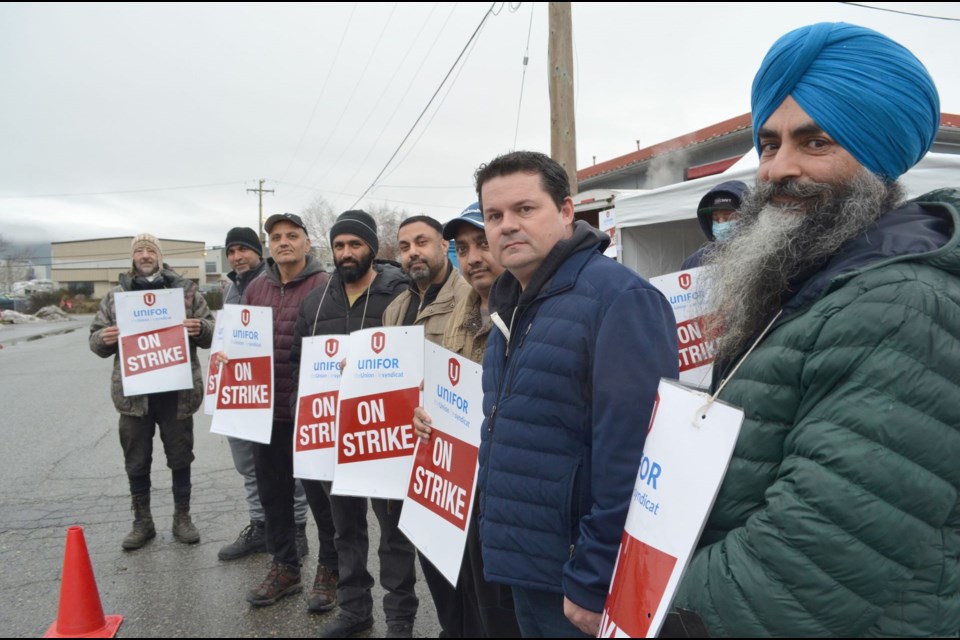 Transit works out on strike on Feb. 8. National representative Chris MacDonald is second from the right.