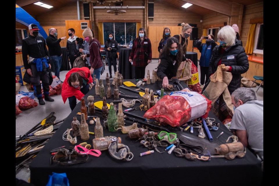 Trash that was recovered from area waterways and that will be transformed into art by local artists. 