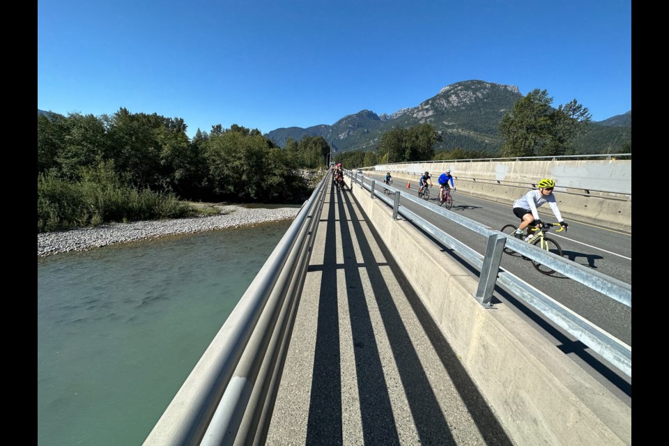 Ƶappphotographer Colin Bates captured this stunning image of GranFondo cyclists and pink salmon crossing on the Highway 99 overpass over the Mamquam River, facing south on Saturday (Sept 9).