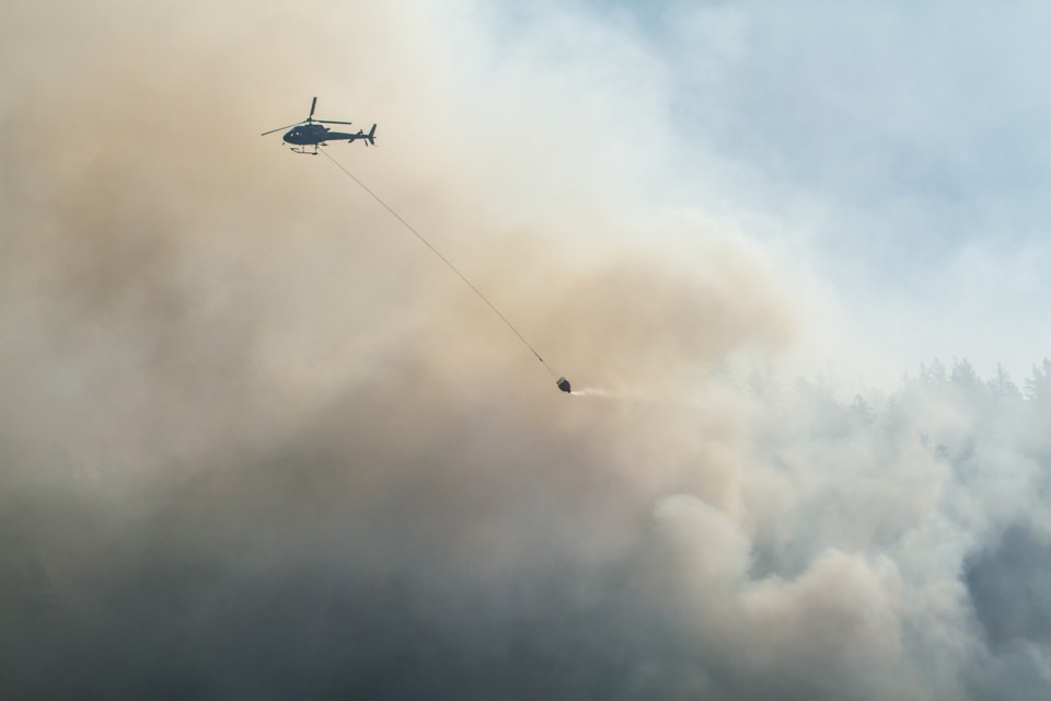 All eyes have been on the Dryden Creek fire in Squamish since Monday.
Local photographers have turned their lenses toward the blaze.
Here’s a selection of some of their striking images.