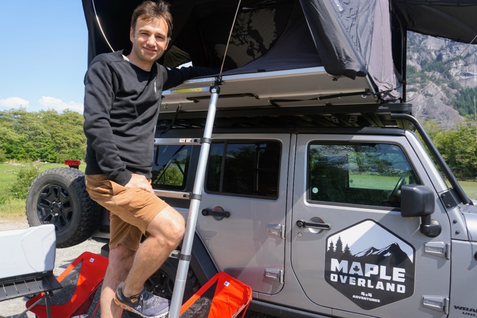 Owner Igor Dochkov shows off the Jeep.                              