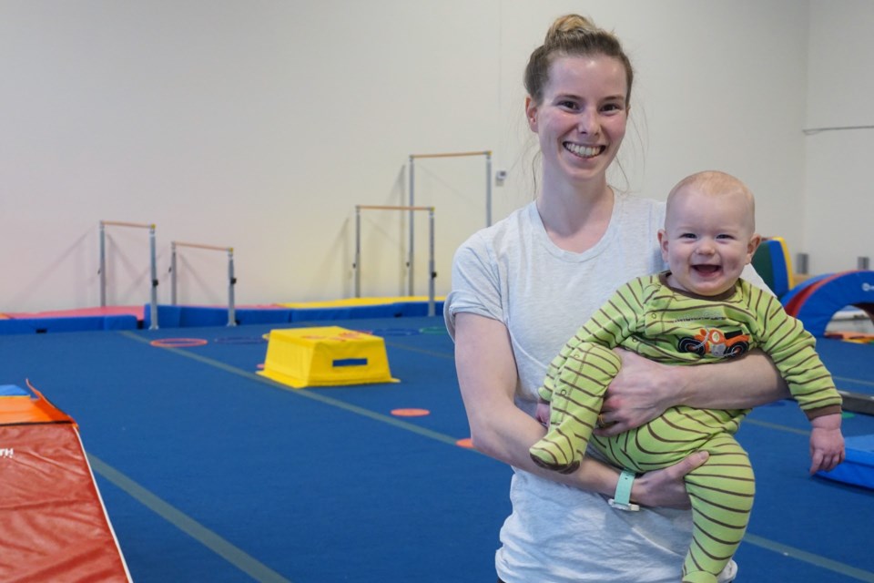 The founder and director of the gym, Olivia Dykes, with her son.                  