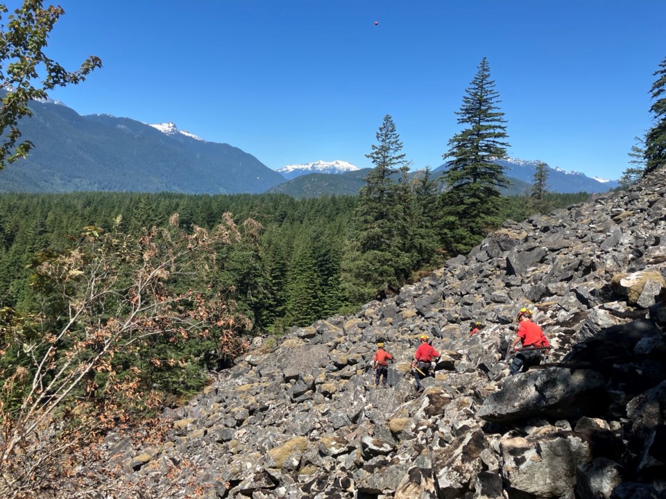working-to-identify-and-extinguish-hotspots-in-tough-terrain-on-the-dryden-creek-wildfire-v30558