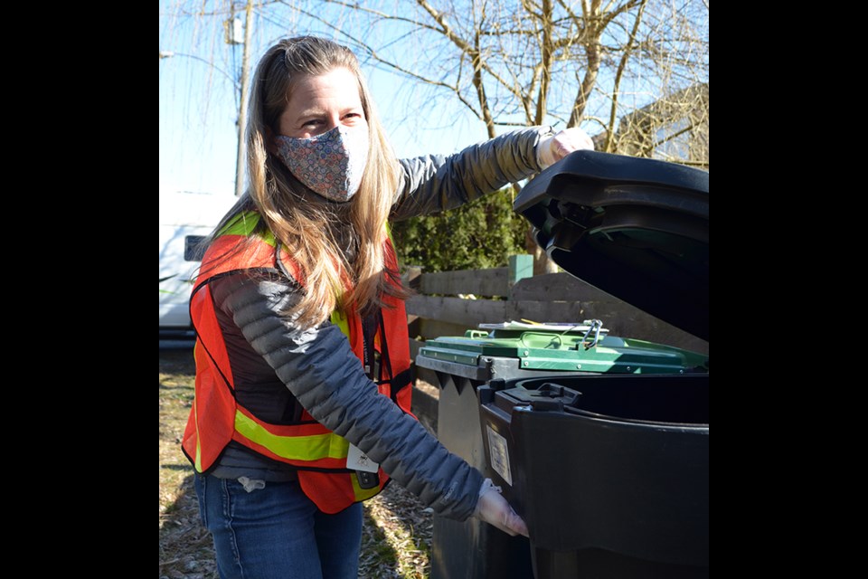 District of Ƶappwildlife officer Meg Toom shows off some of the new bear-resistant totes being piloted by the municipality.