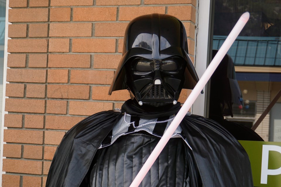 Nicholas Bowman dresses up as Darth Vader for May the Fourth much to the delight of some spectators.                             