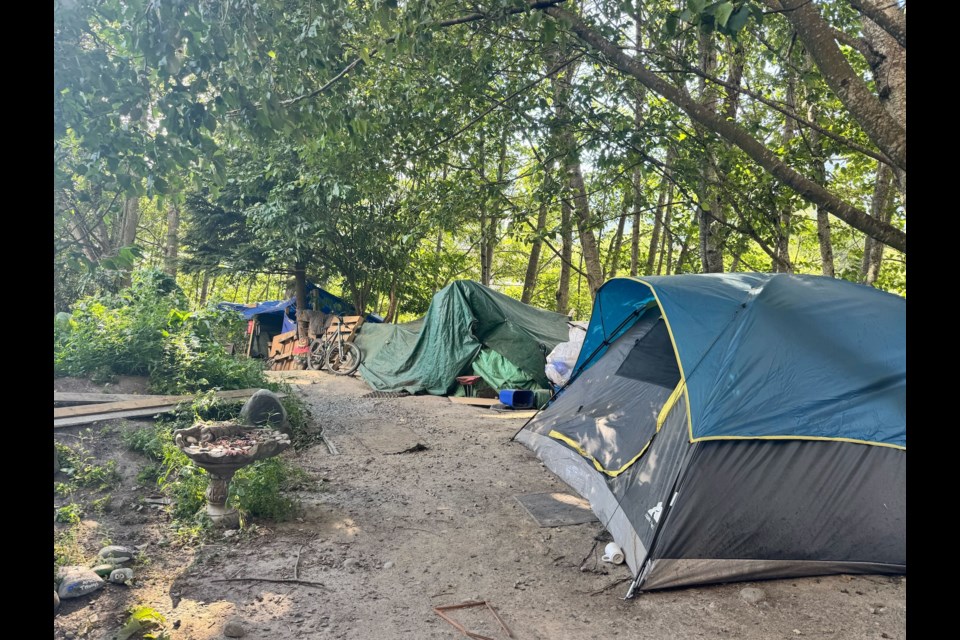 The encampment behind Under One Roof, where some unhoused folks are living.