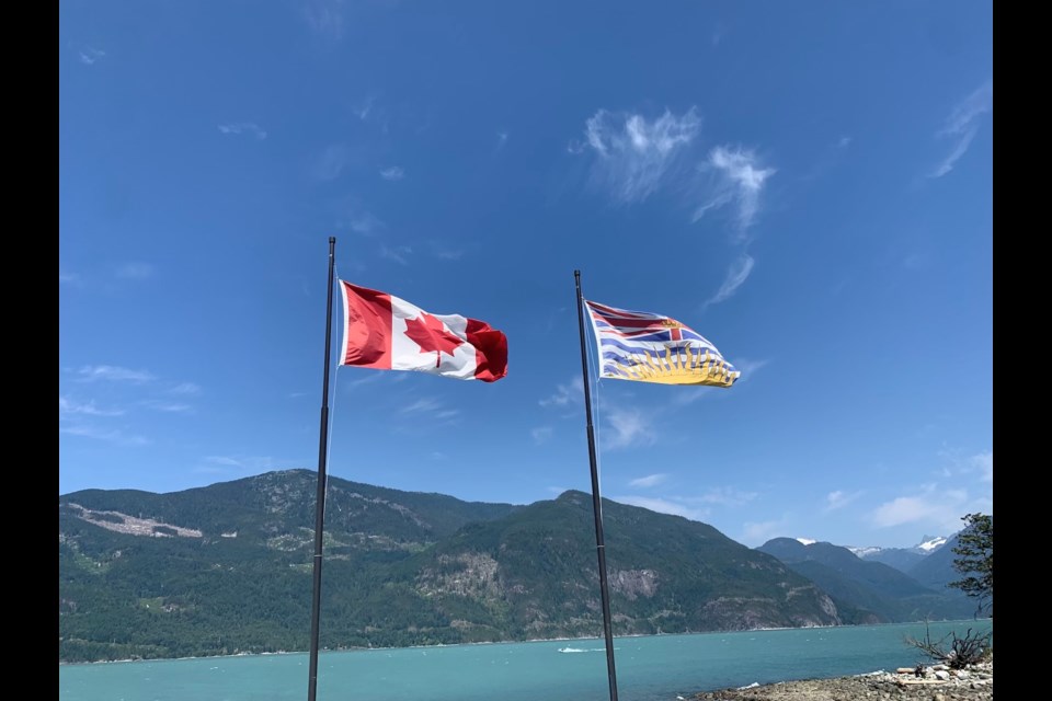 Flags at the Furry Creek viewing platform at Oliver's Landing.