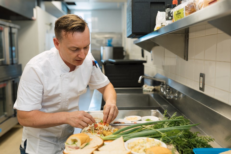 Head chef Michael Staveley preparing a school lunch.