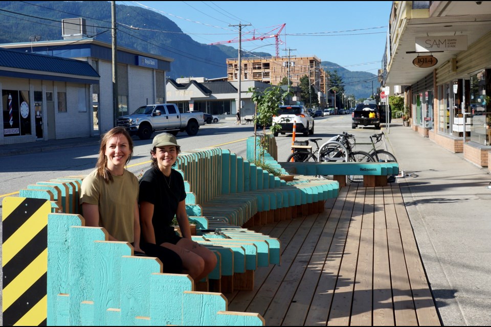                            

OurSquamish's president Sarah Ellis (left) and Cléa Rochon-Berman, the society's executive director, sitting on the new wooden Second Avenue parklet in front of Alice + Brohm Ice Cream., on July 20.
