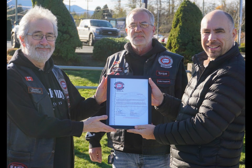 Members of the The Greater Vancouver Chapter of Bikers Against Child Abuse (BACA) presented councillor John French with a letter of thanks on Saturday, Nov. 18.