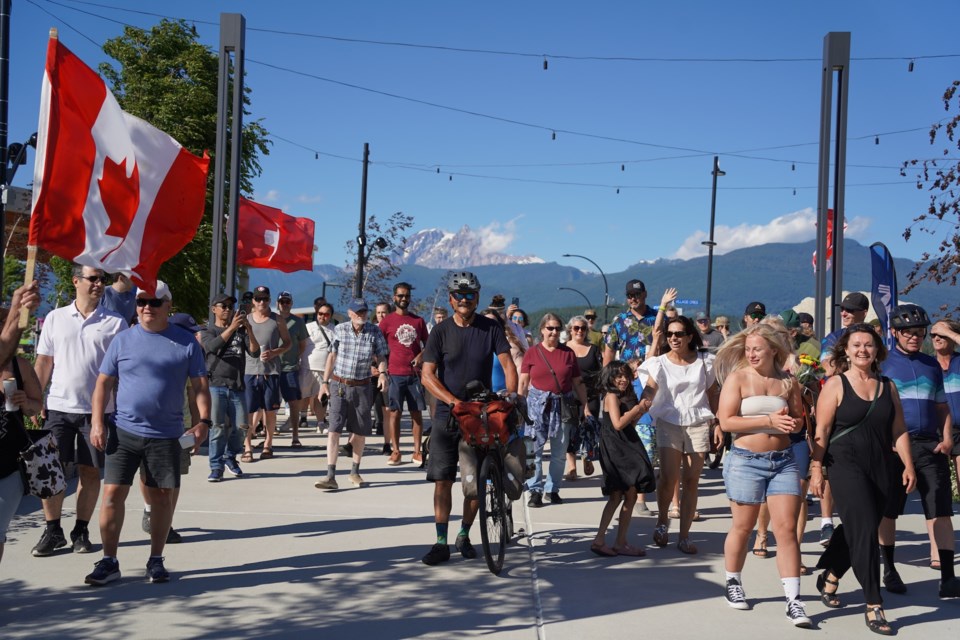 Local bike rider Daniel Gloor. as he was welcomed by loved ones and friends on Saturday evening.