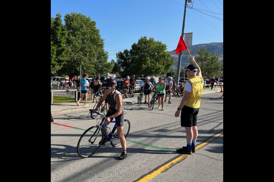 Lois Lemieux has entered a lot of races, so she knows the importance of volunteers to each event, she says. (Here at the Oliver Triathlon.)