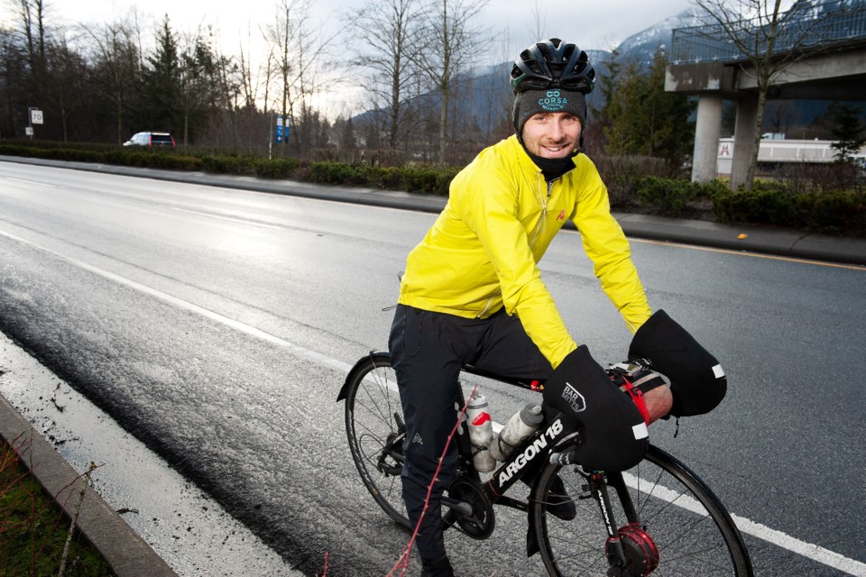 Ƶappbike racer Jack Burke beside highway 99. 