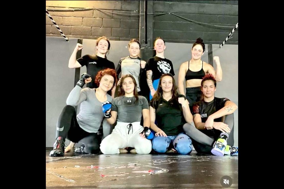 Jamey-Lyn Horth Wessels (top row, third from right) with some of the fighters she trained with at the famed Lobo Gym in Guadalajara, Mexico.