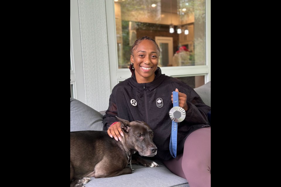 Charity Williams, with her dog,  Arya, in Squamish on Monday.