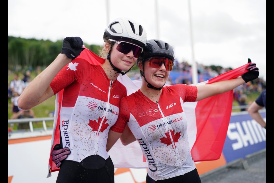 2023 UCI Cycling World Championships -  MTB  Cross Country - Glentress Forest, Peebles, Scotland - Junior Women Cross-country Olympic - Isabella Holmgren - Canada (L) with teammate Marin Lowe after they finished 1- 2 in the world championships.